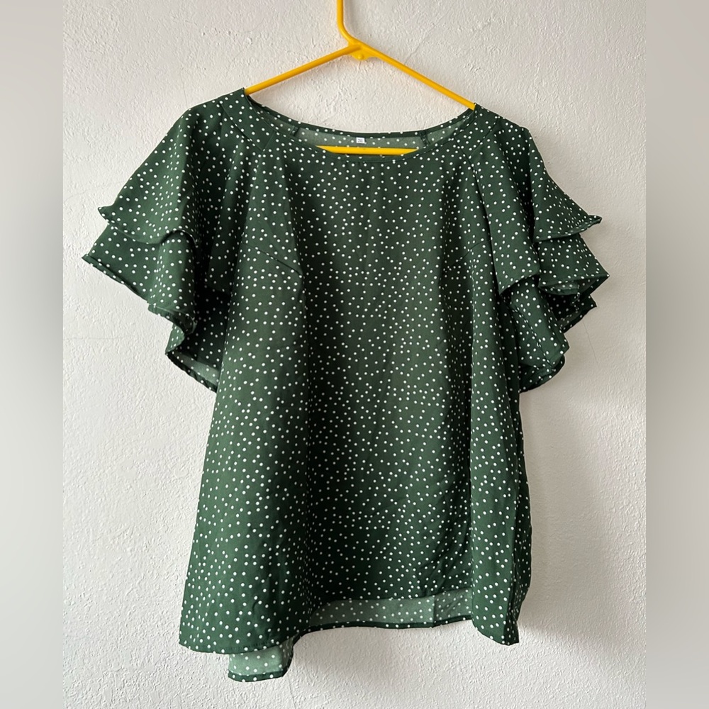 Green and white polka dot flutter sleeve blouse